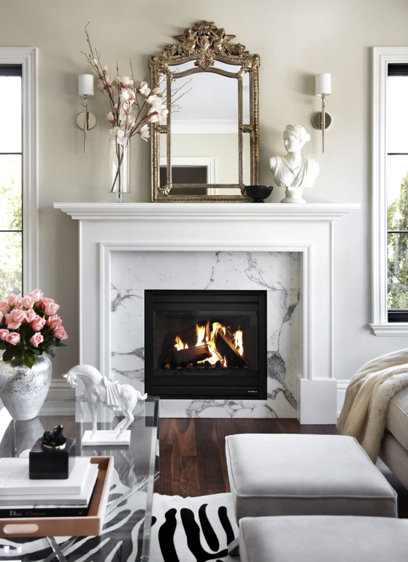 White Bust on Fireplace living room via The Design Co