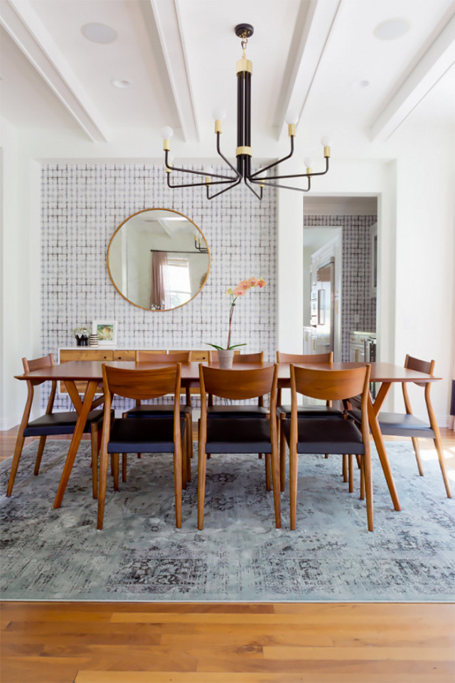 Soft blue overdyed rug in wood dining room via Studio McGee