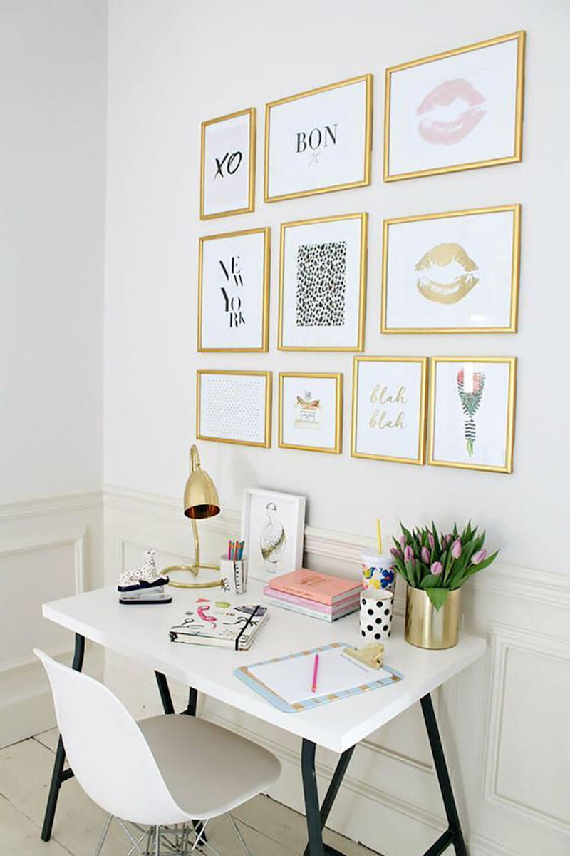 Gold gallery wall with white desk