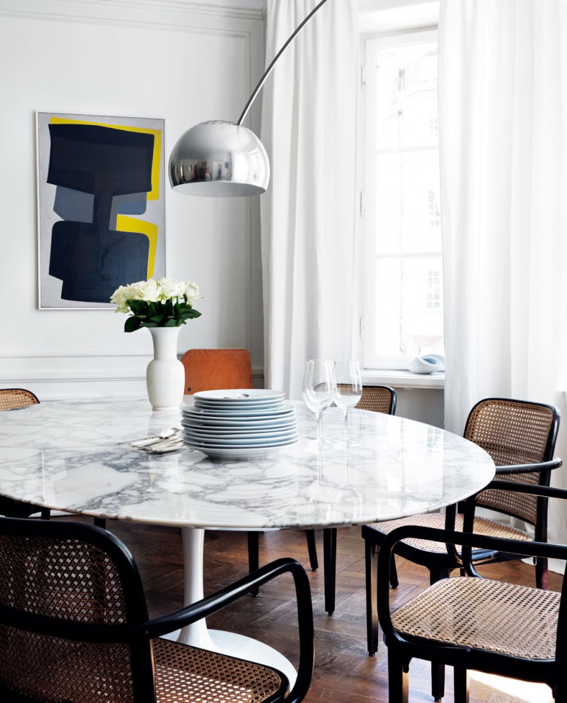 Saarinen Tulip dining table with marble top and Castiglioni Arco floor lamp