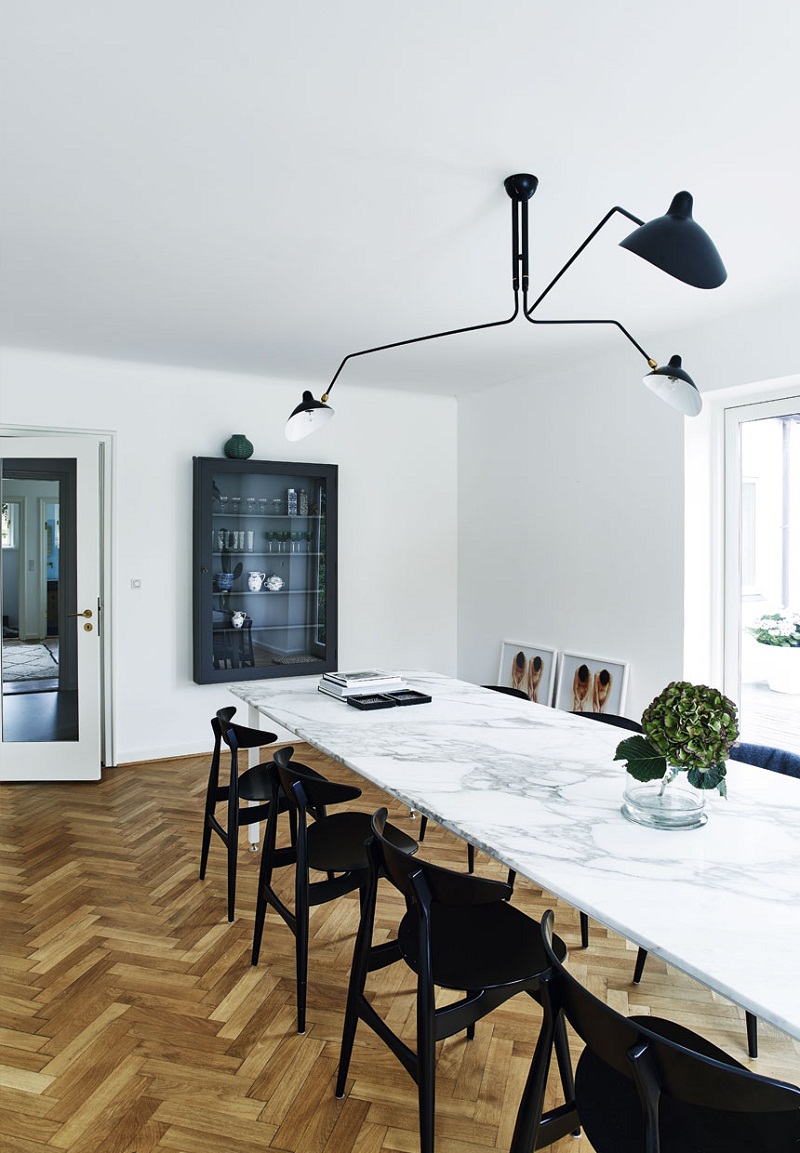 Sophisticated modern white marble dining table with black dining chairs