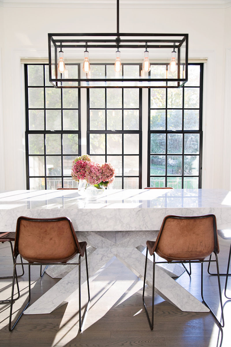 Thick Marble dining table with brown leather chairs