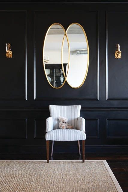 Black Wall Interior brighten the space with mirrors