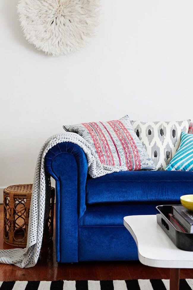 Blue Velvet Sofa with juju hat from Alana Langan's Home on The Glitter Guide