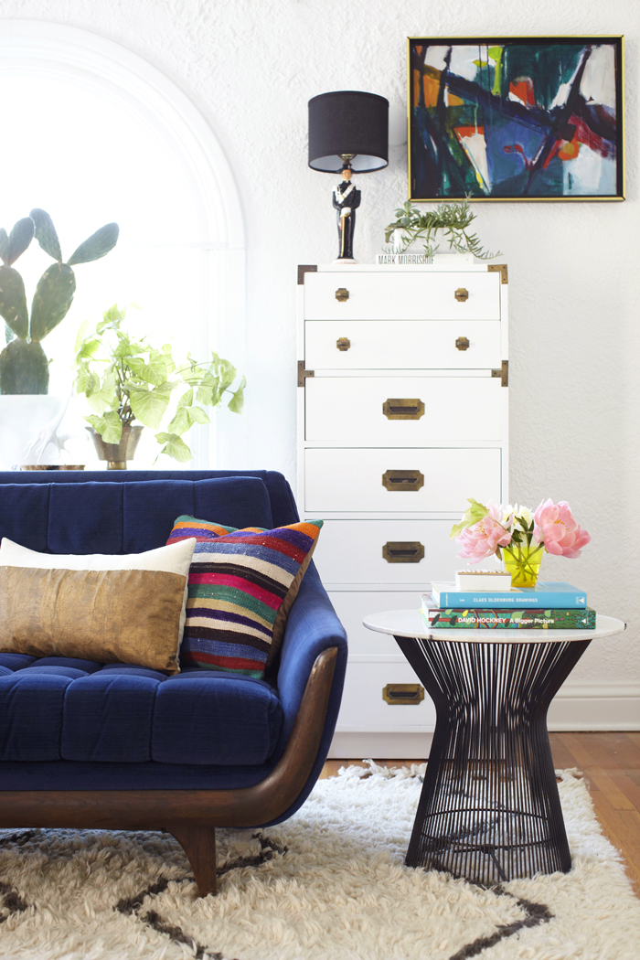 Lovely blue velvet sofa in Emily's living room