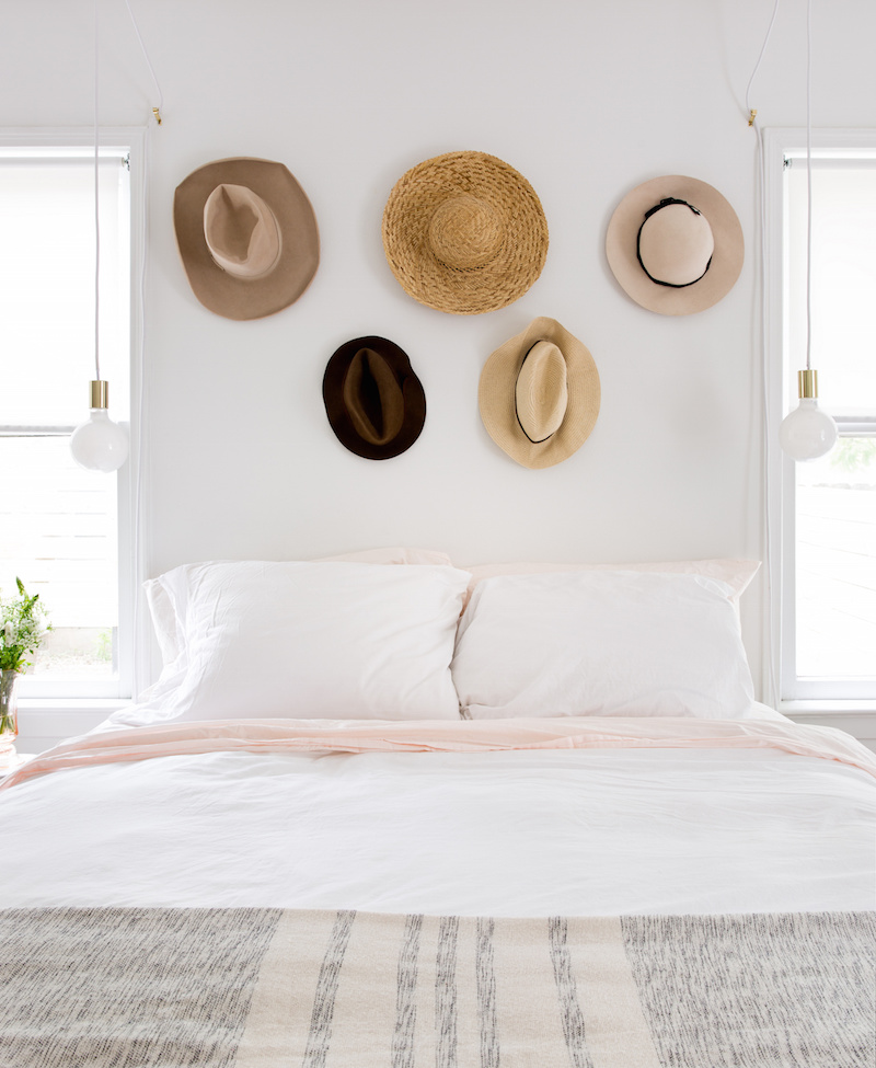 Claire Zinnecker Bedroom with hats on the wall