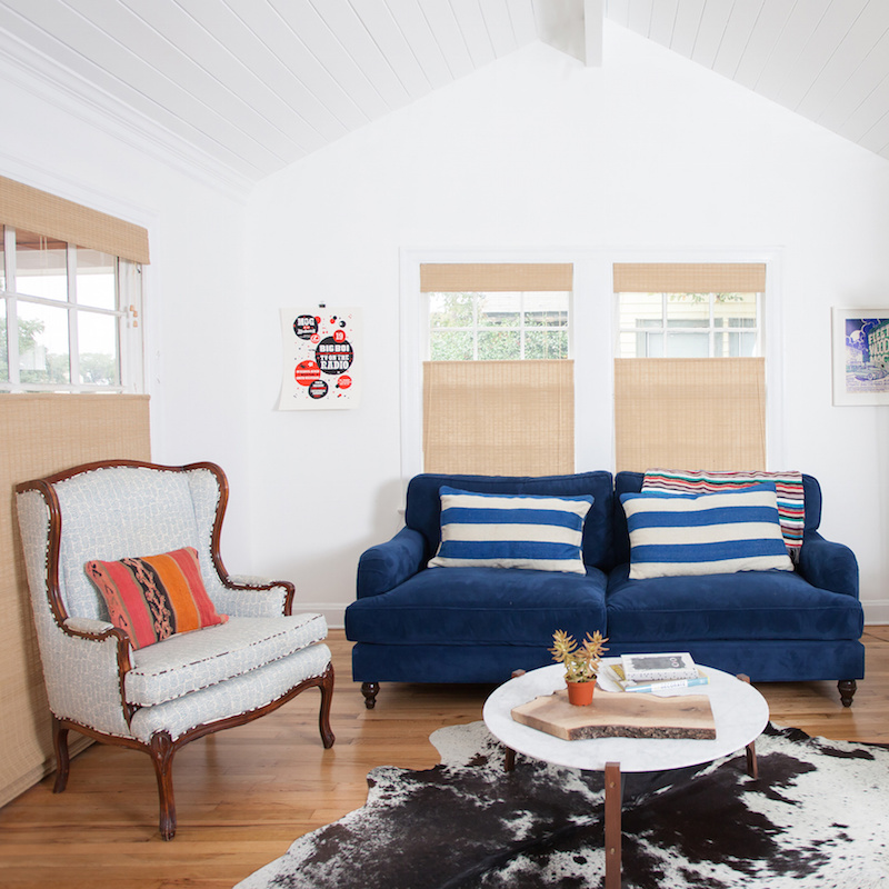 Claire Zinnecker Blue sofa with black and white rug