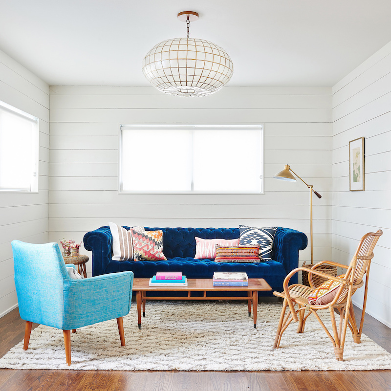 Claire Zinnecker Blue velvet couch with white paneling