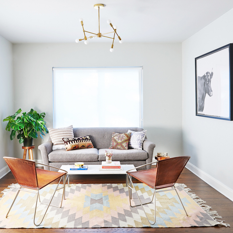 Claire Zinnecker Grey couch with geometric rug