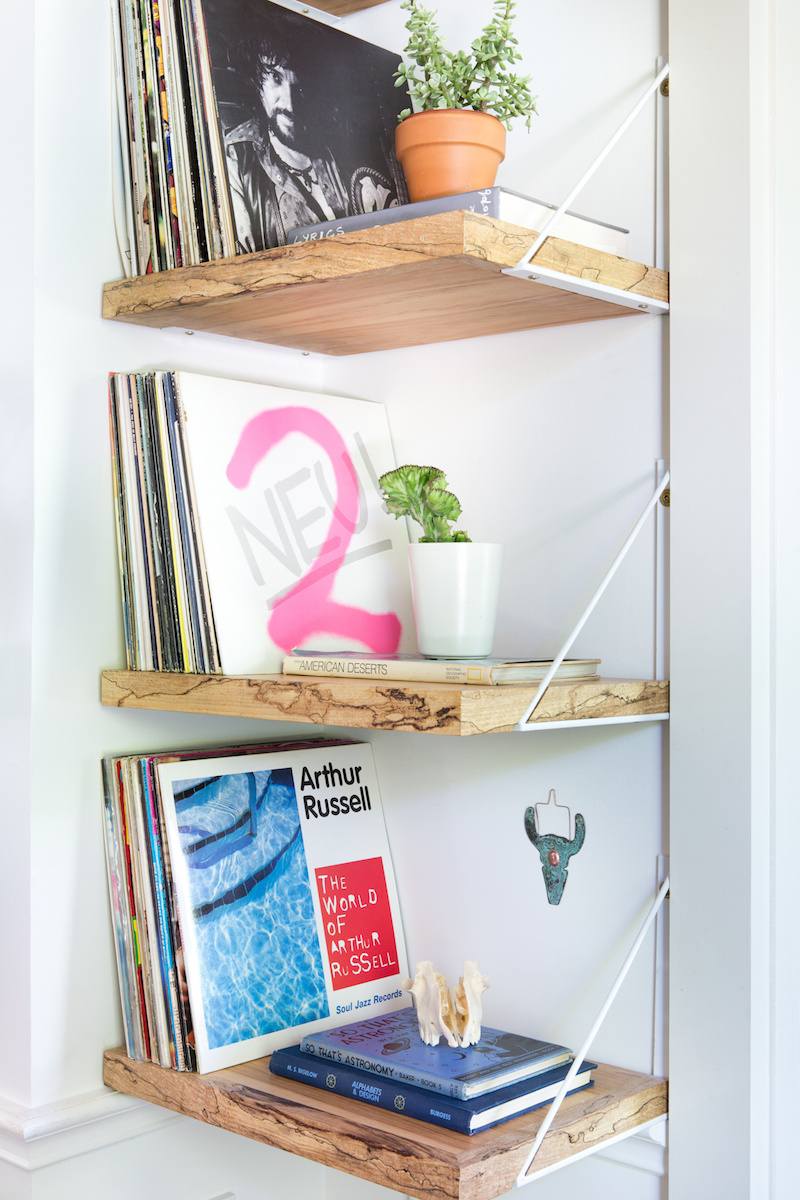 Claire Zinnecker Natural wood shelving with records