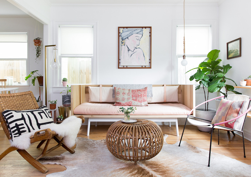 Claire Zinnecker Pink sofa with wicker coffee table