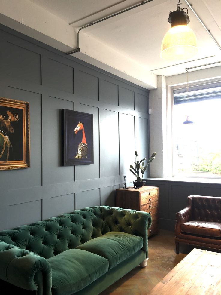 Traditional living room with Dark Green Velvet Sofa with Blue walls