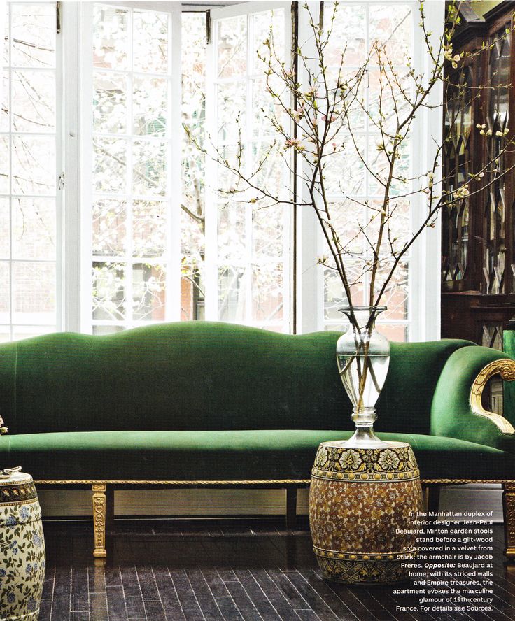 Traditional living room with Green Velvet Sofa with Gold Base and Branches