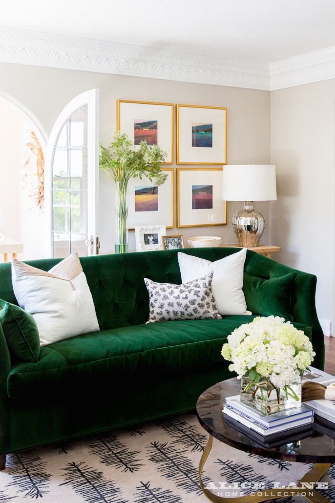 Green Velvet Sofa With White Pillows 686x1030 