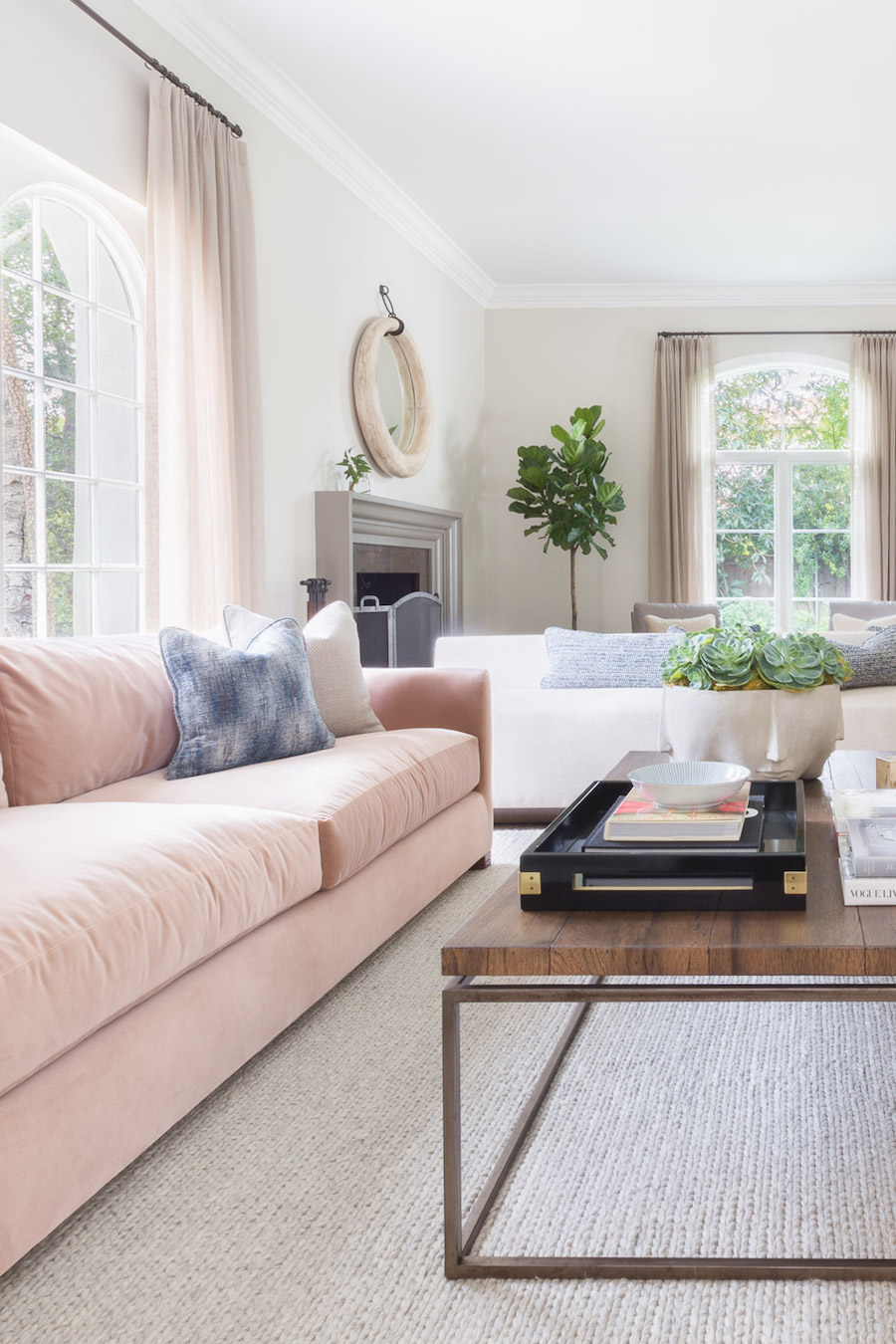 Pink couch in a Living Room by Amanda Barnes