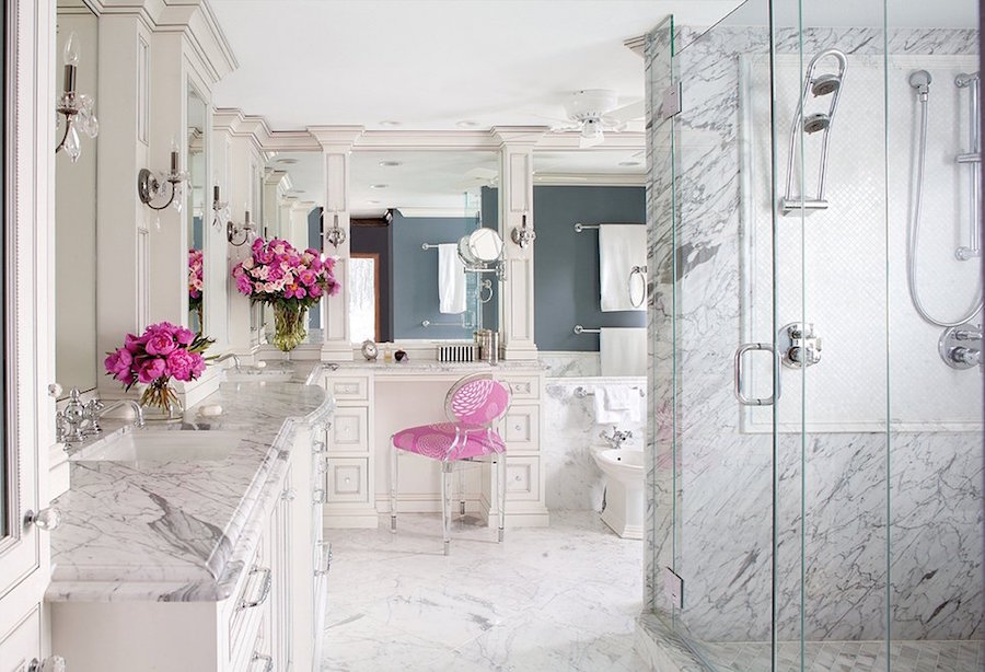 Marble Bathroom with Silver Fixtures and Pink Flowers
