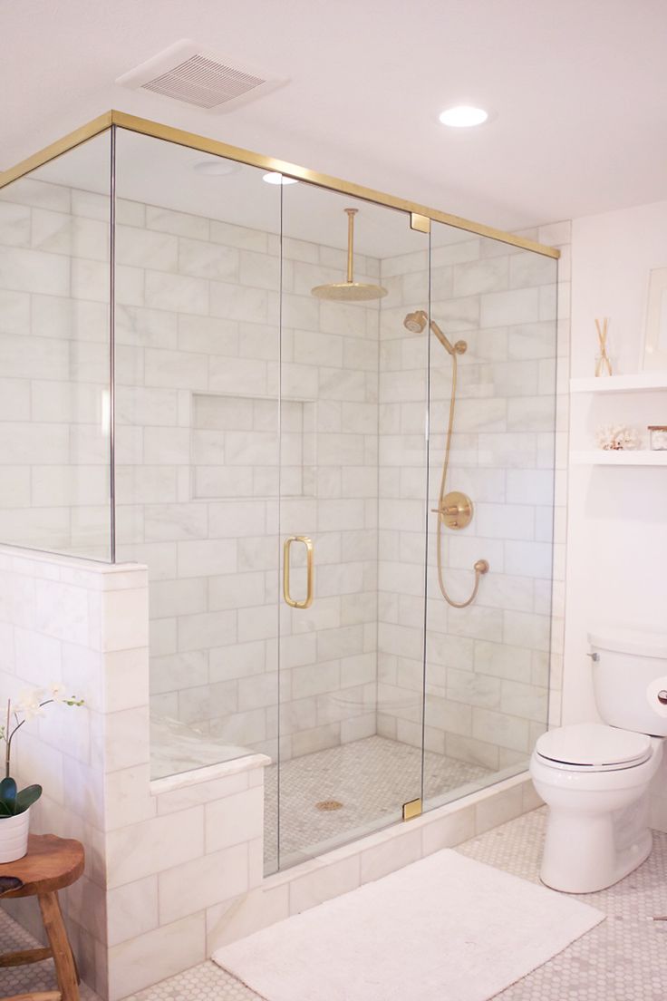 Marble Shower with Glass Doors lined in Brass