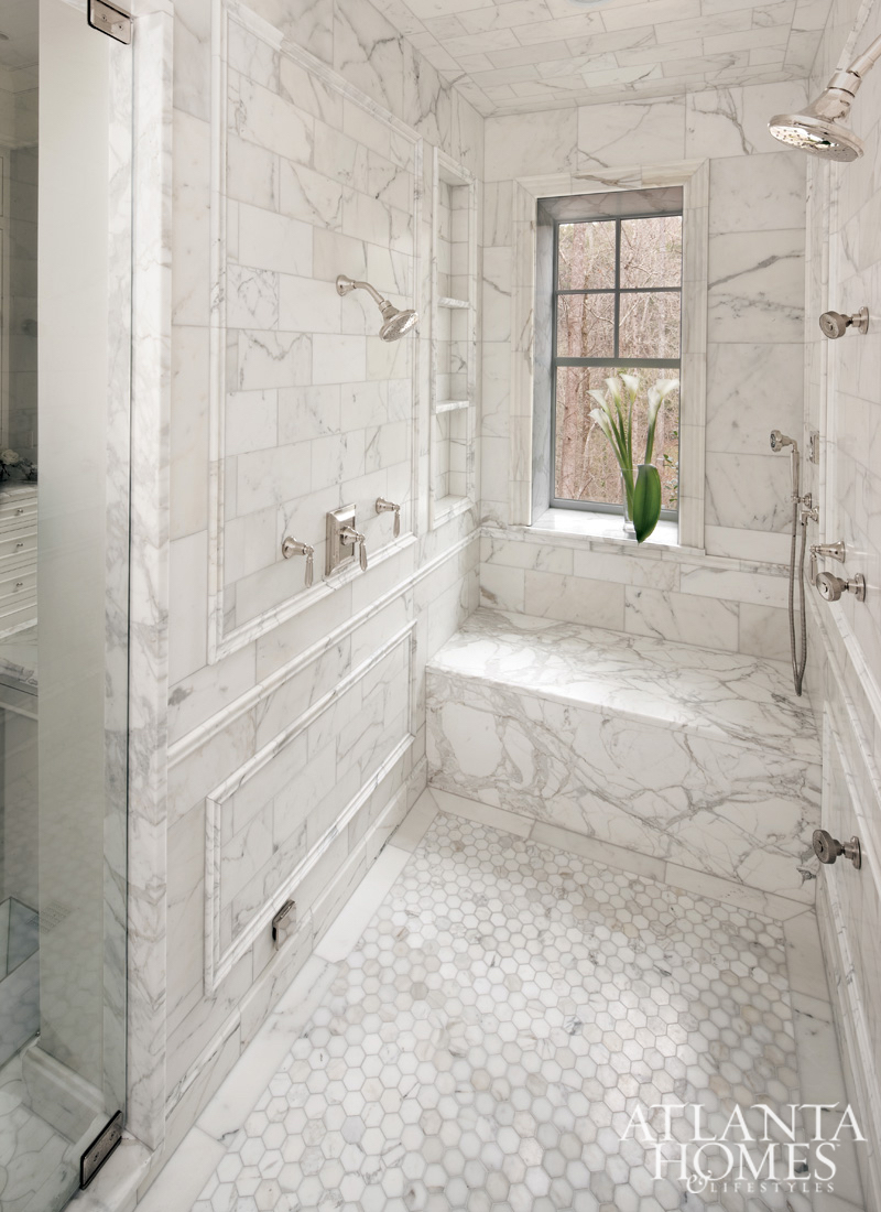 Marble Sit-down Shower with Silver Fixtures