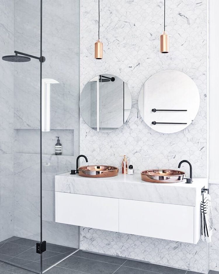 Rose Gold Sink in a Marble Bathroom