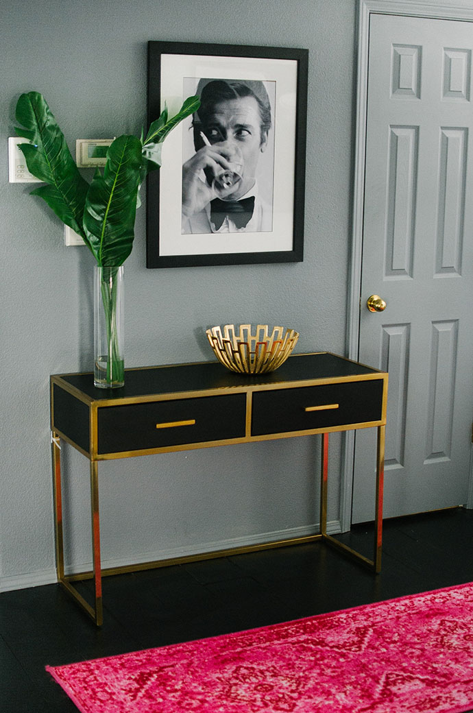 Black and gold console table entryway