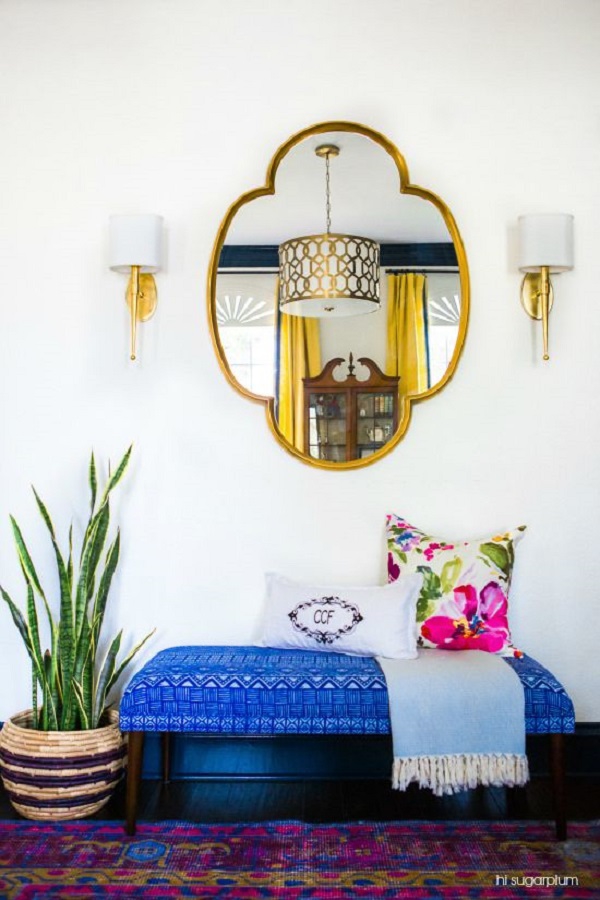 Blue bench Entryway with plants and gold mirror via hisugarplumsblog