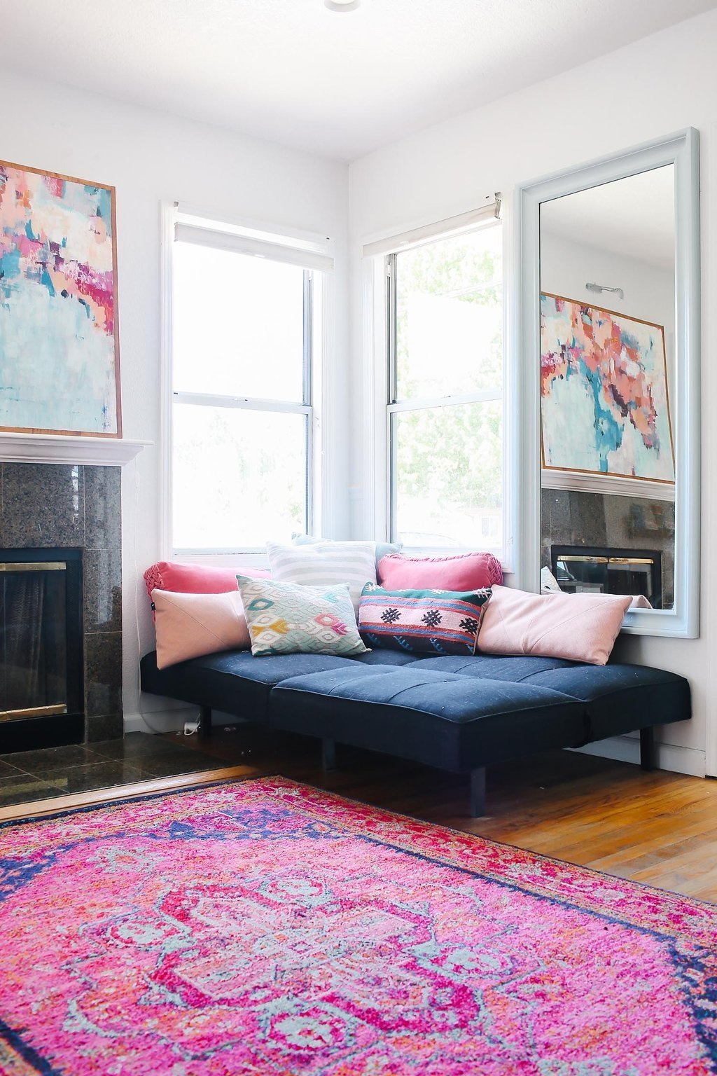 Corner chaise with pillows via Apartment Therapy