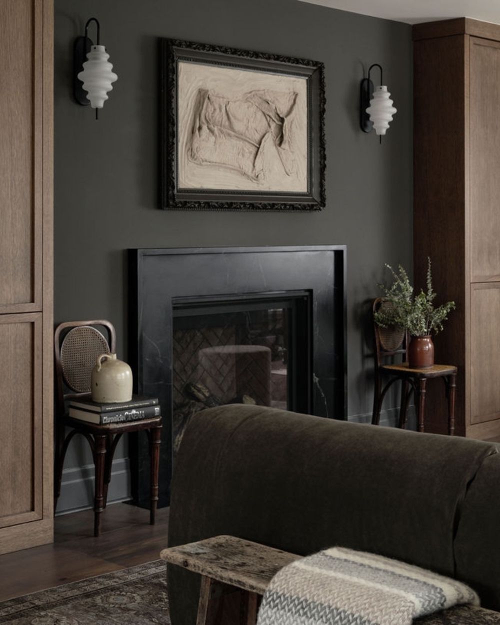 Dark and moody living room design fireplace