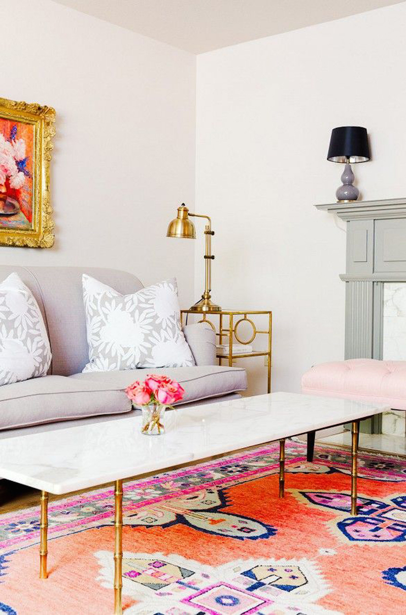 Living room with grey and white flower throw pillows