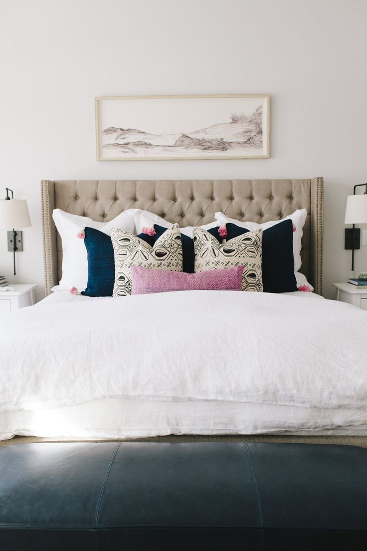 Nude tufted headboard with matching throw pillows