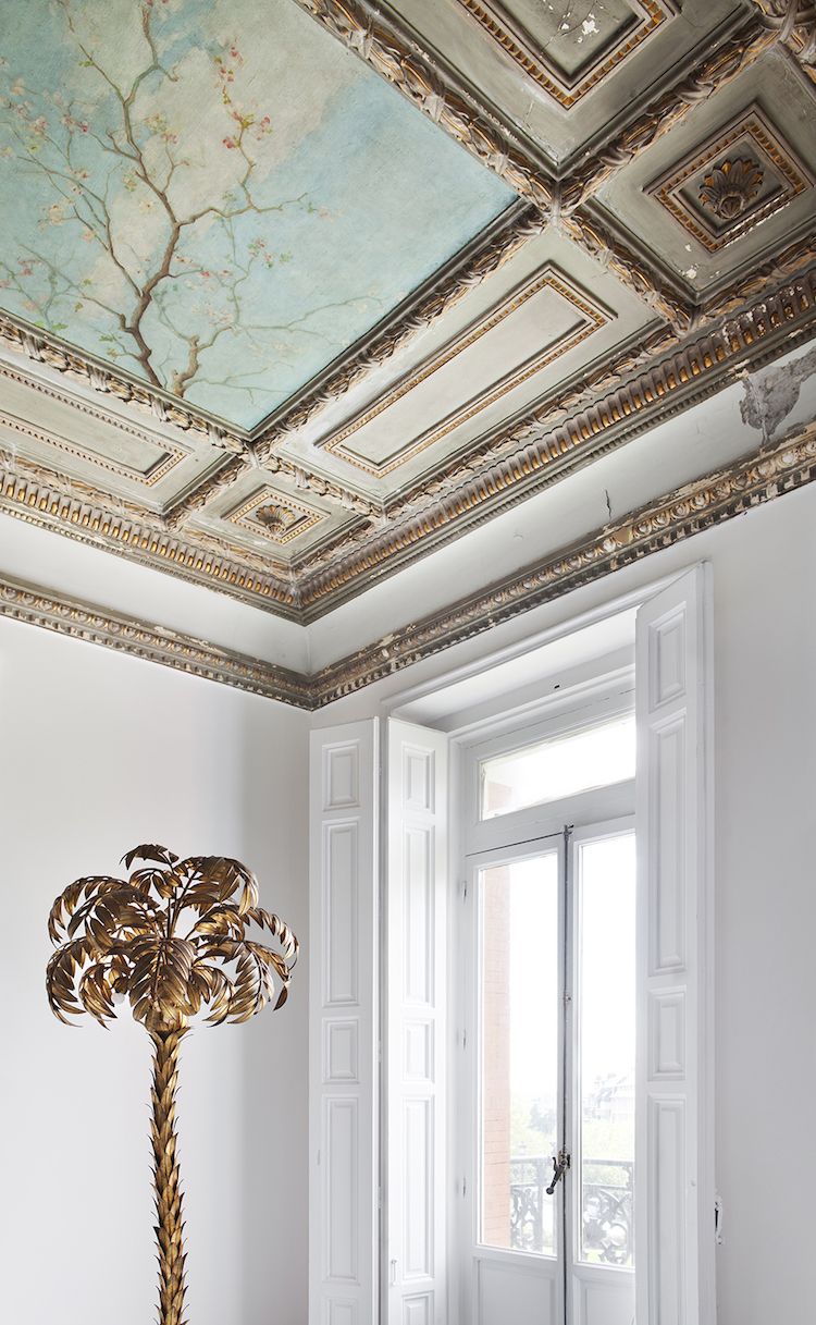 Painting ceiling with beautiful millwork and gold palm tree, design by Beatriz Silveira