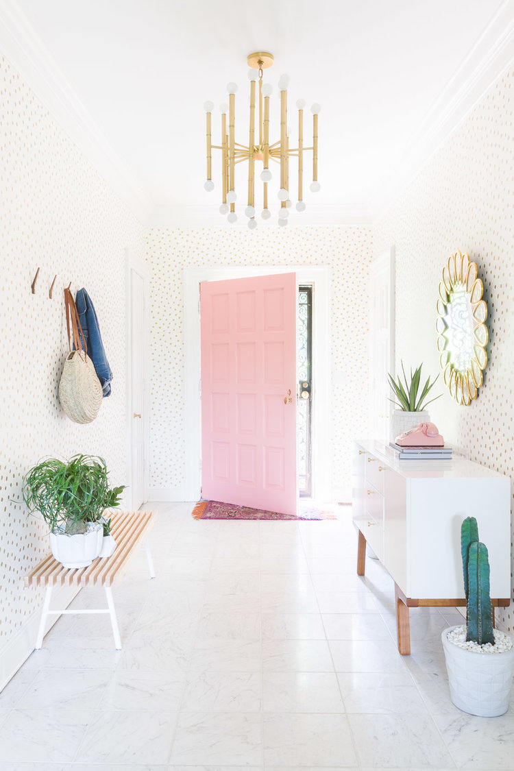 Pastel Pink Door Entryway with cactus and gold polka dot wallpaper via Alyssa Rosenheck