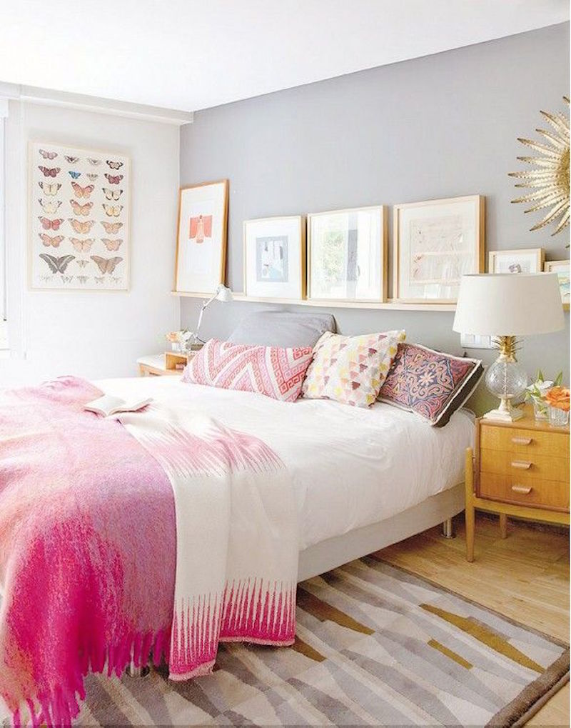 Pink bed with eclectic throw pillows