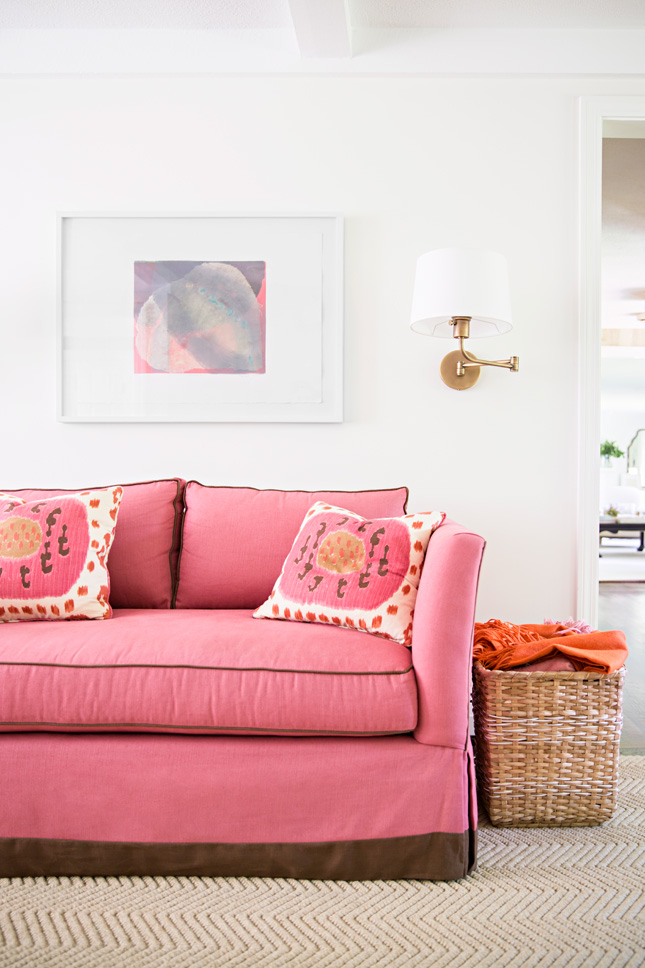 Pink couch with matching pink pillows