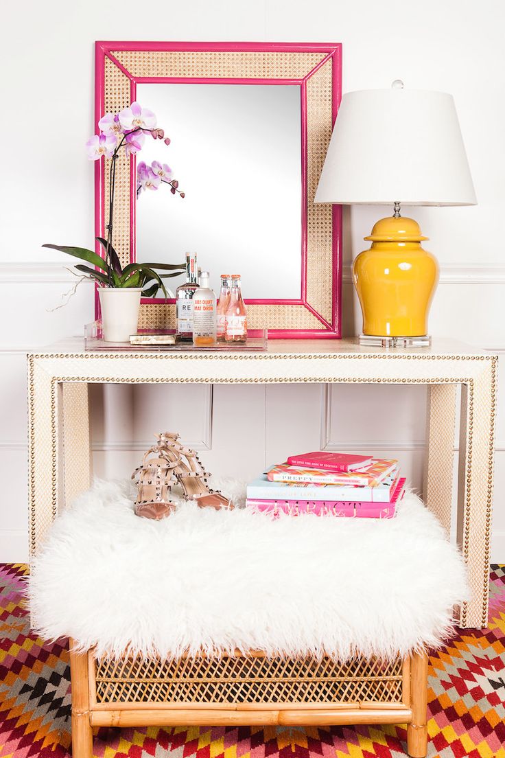 Preppy beach chic entryway with wicker stool