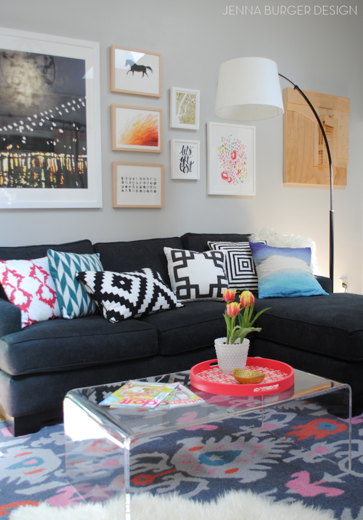 Sofa with eclectic patterned throw pillows via Jenna Burger