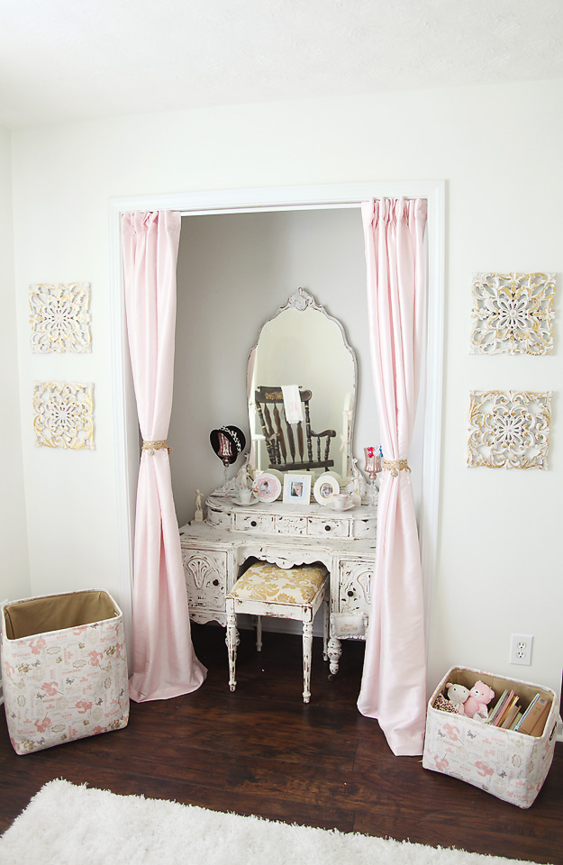 Vanity desk tucked away with pink curtains via Project Nursery