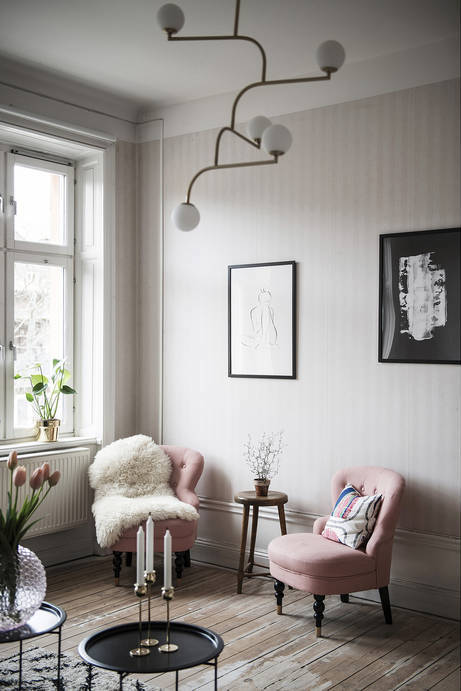 A Stockholm Apartment with Vintage Fireplaces & Pink Chairs