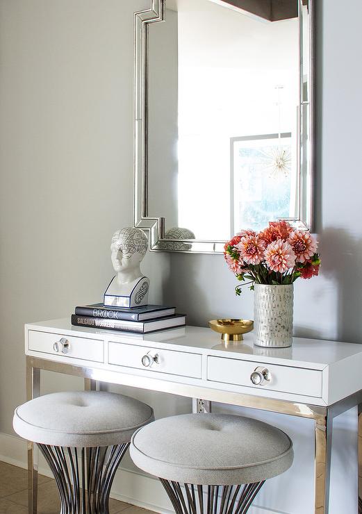 White 3 Drawer Console Table with Gray Button Tufted Stools at Entryway