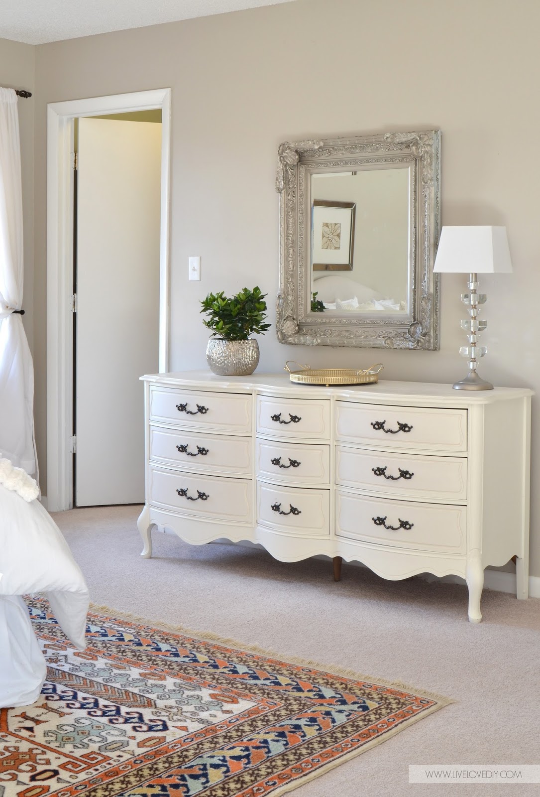 White glamorous vintage dresser in bedroom