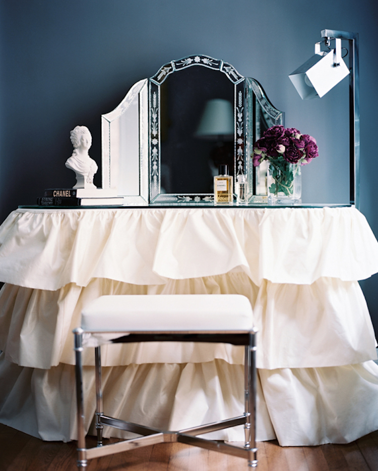 White ruffle vanity with trifold venetian mirror via Patrick Cline