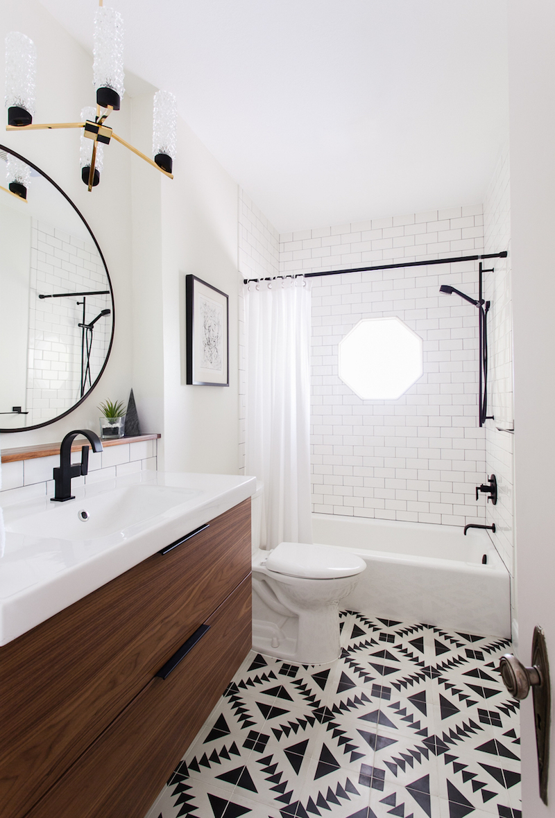 Bathroom with black and white tiling via Maggie Stephens Interiors