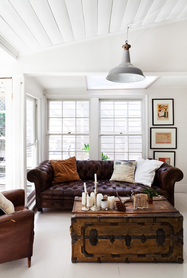 Dark brown leather couch with vintage trunk table