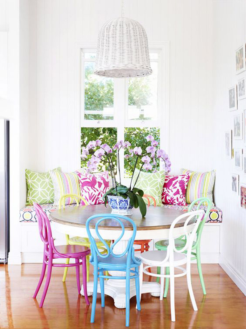 Dining room with multi-color french chairs