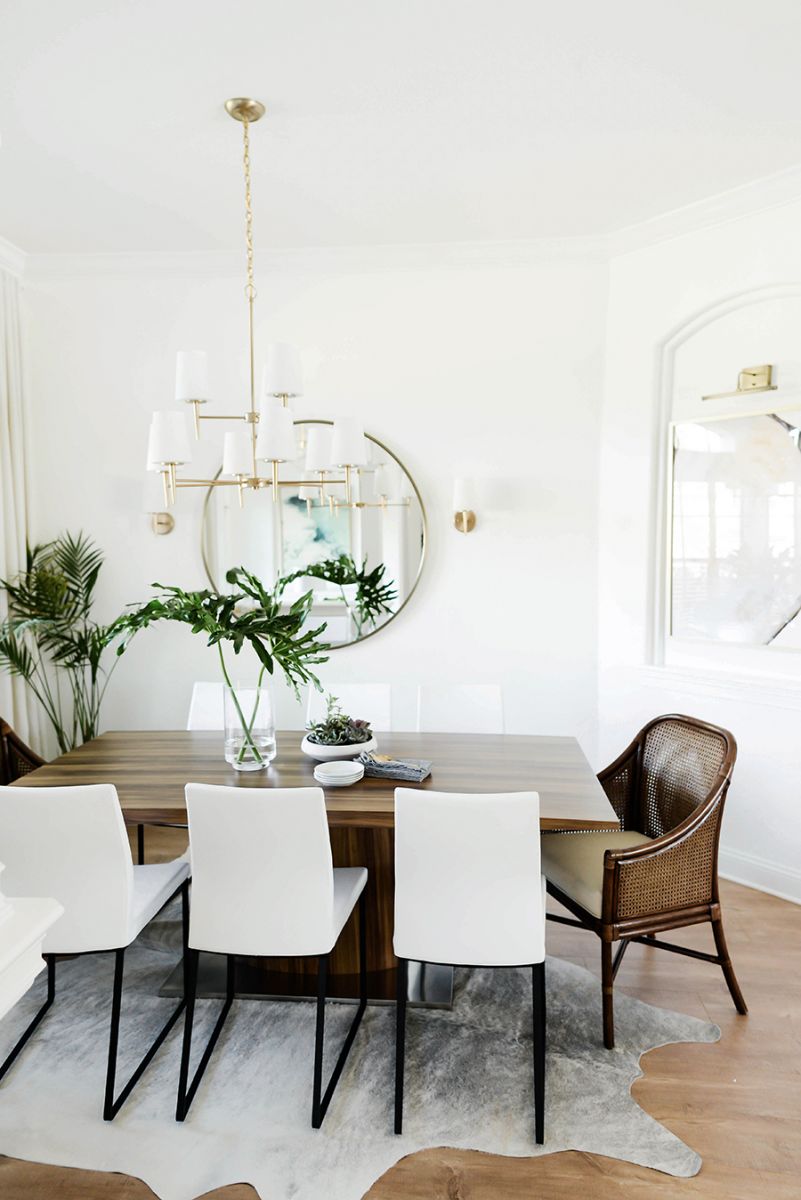 Dining room with wood table and white chairs