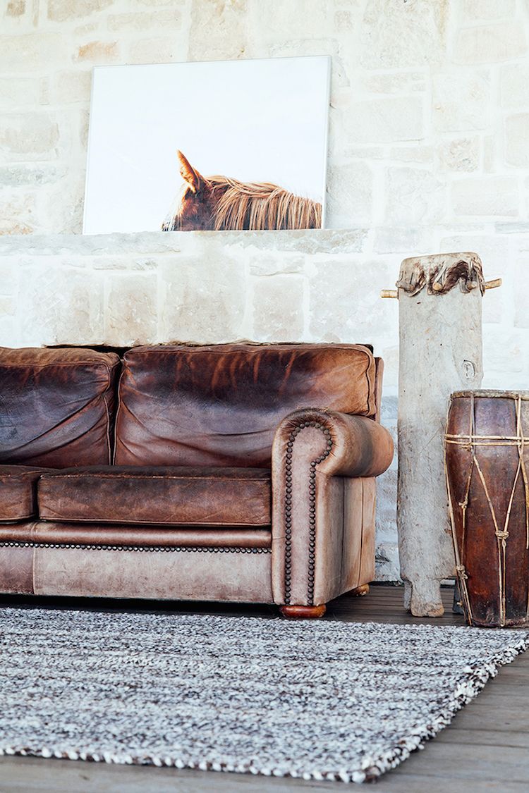 Distressed brown leather sofa with drums