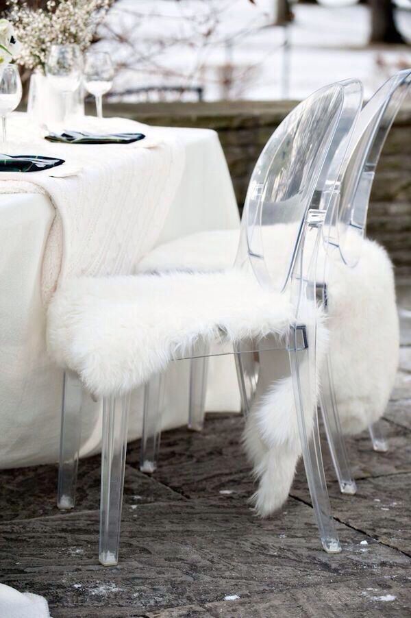 Ghost Chair with white faux sheepskin rug as seat cushion