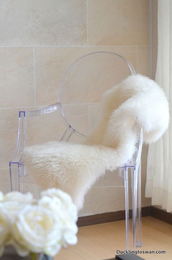 Ghost chair with white faux fur seat cushion