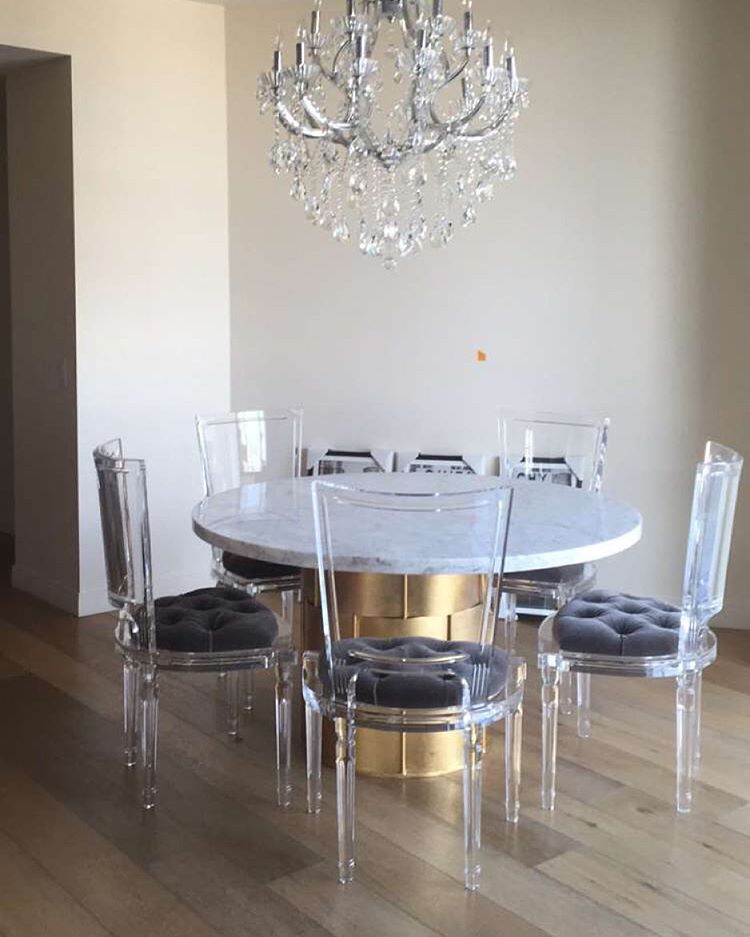 Ghost dining chairs with marble table