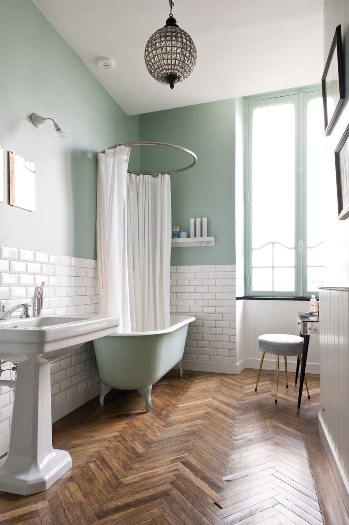 Hardwood floor bathroom with freestanding tub