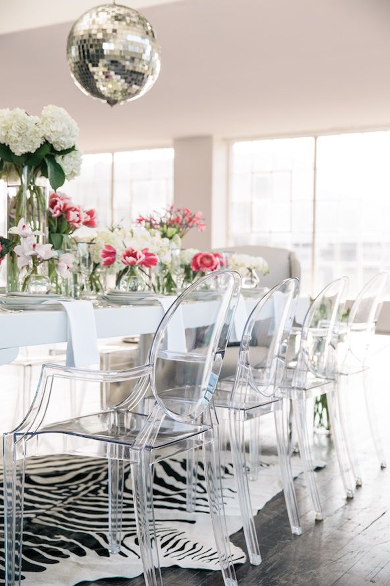 Ghost chairs for dinner table with disco ball